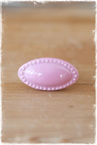 ovale roze porseleinen deurknop